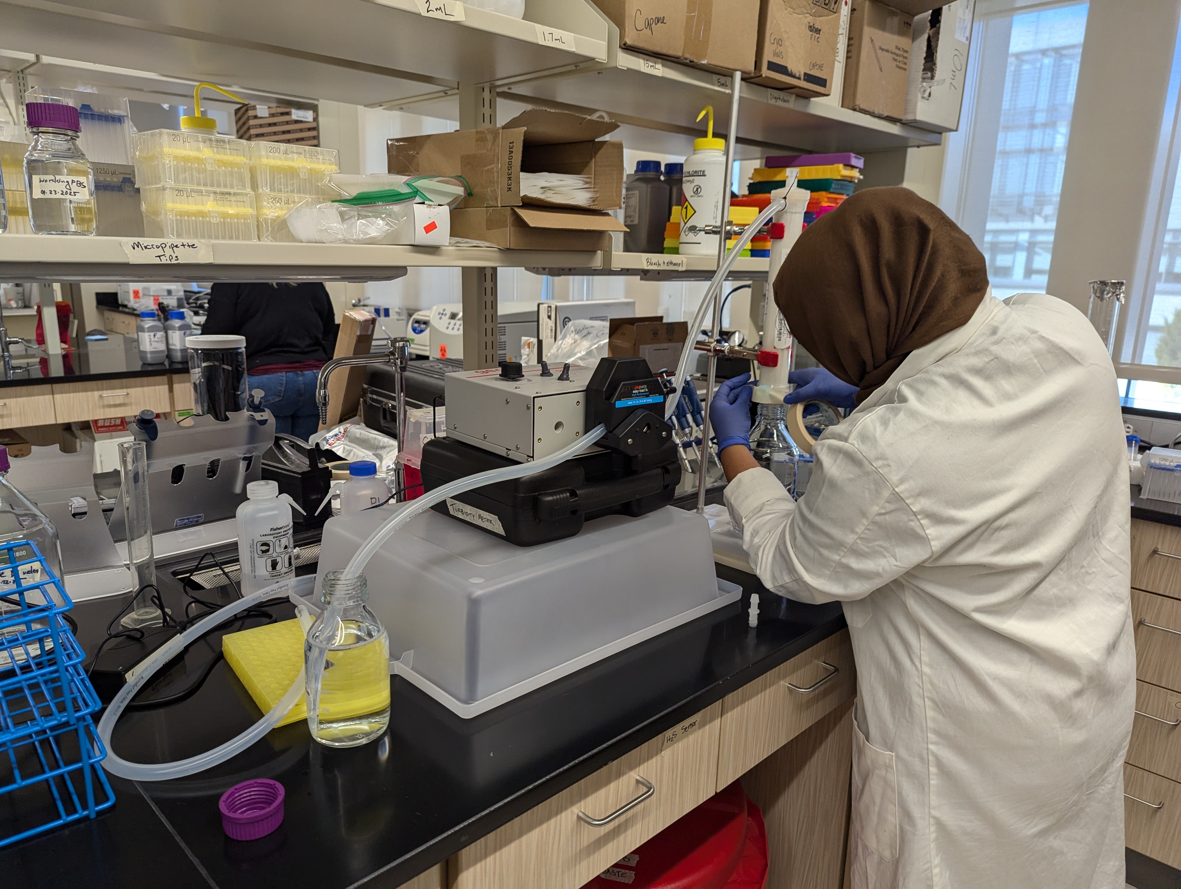 Fatema in the lab processing water 